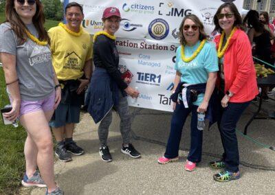 TiER1ers posing for a photo while volunteering at the DaySpring Walk for Dreams in May 2022.