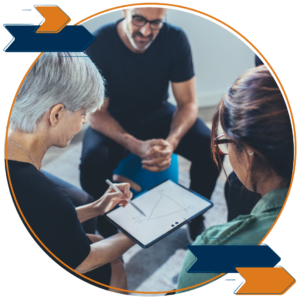 Three colleagues collaborating on an iPad.