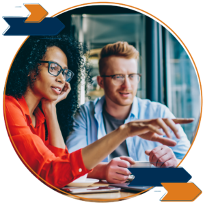 Two colleagues collaborating on a laptop.
