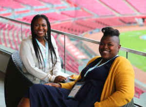 Two EXLEARN Attendees relaxing in Great American Ball Park between sessions.